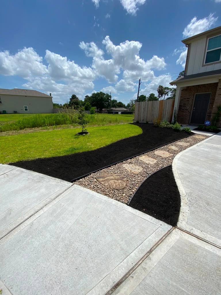 Refreshed residential landscape bed by Rainlandscaping